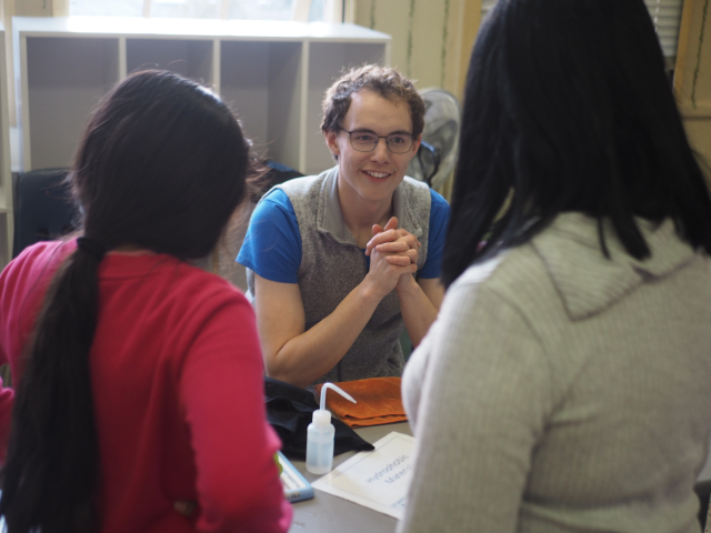 Erick presenting a materials science exhibit at a local school's Science Night